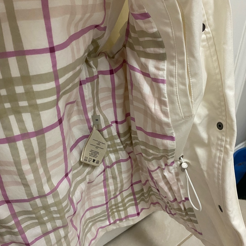 Burberry rain jacket. Hood is missing. Jacket is in like new condition.